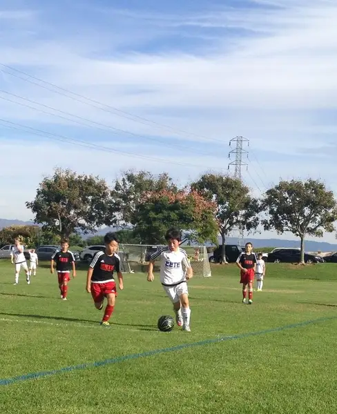 Rec soccer players competing on the field